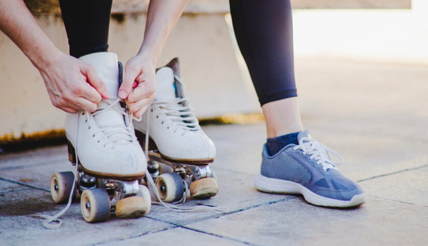 Hands tying the skates